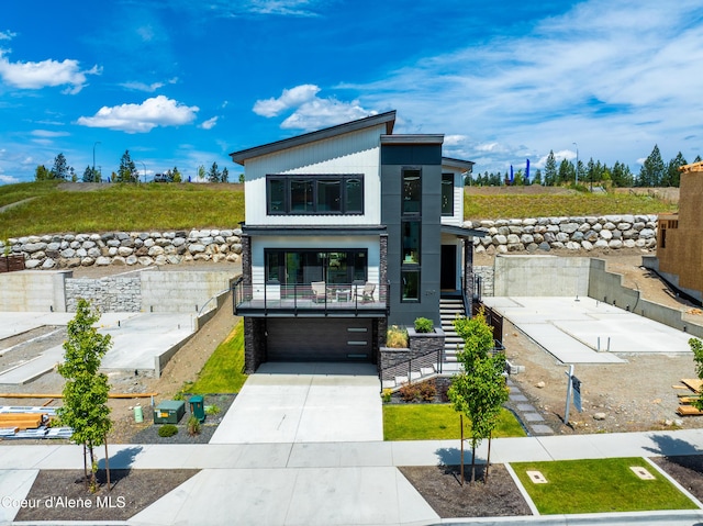 2747 W Lumber Ln, Coeur Dalene, ID 83814 - contemporary home with a garage, stairs, and driveway