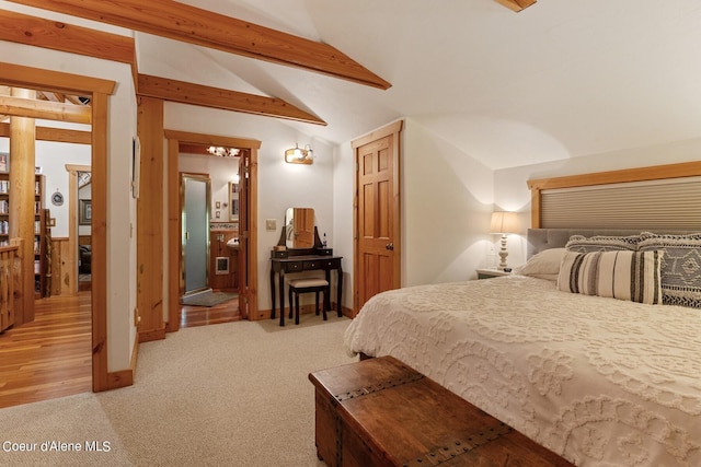 bedroom featuring lofted ceiling with beams and light colored carpet