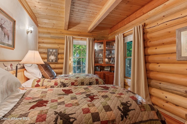 bedroom with log walls, access to exterior, wood ceiling, and beamed ceiling