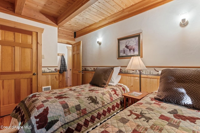 bedroom featuring wood ceiling and beamed ceiling