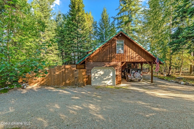 exterior space with a carport and wood walls