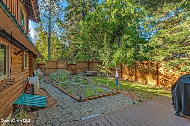 view of yard featuring a wooden deck