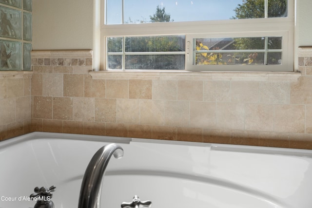 bathroom with a tub to relax in