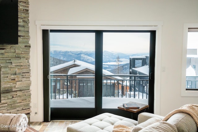 interior space featuring wood finished floors and a mountain view