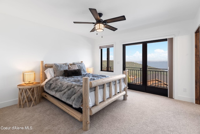 bedroom featuring ceiling fan, light carpet, and access to exterior