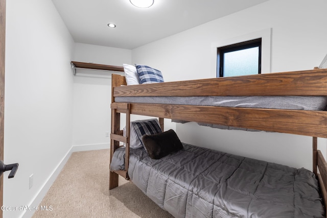 bedroom featuring light carpet, baseboards, and recessed lighting