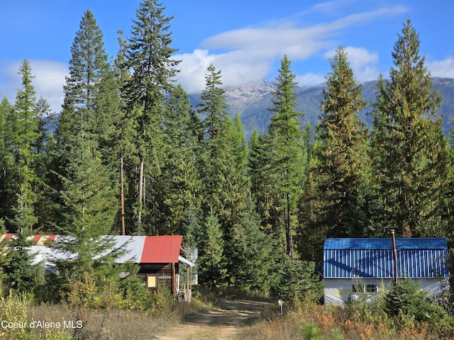 exterior space with a forest view