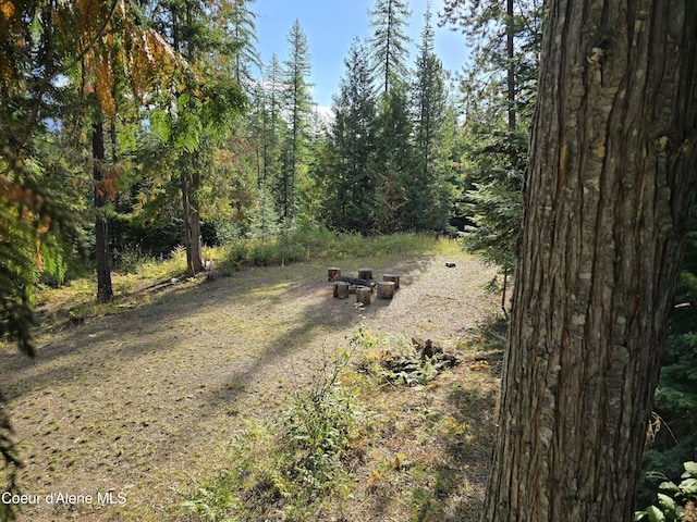 exterior space featuring a forest view