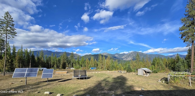 property view of mountains with a forest view