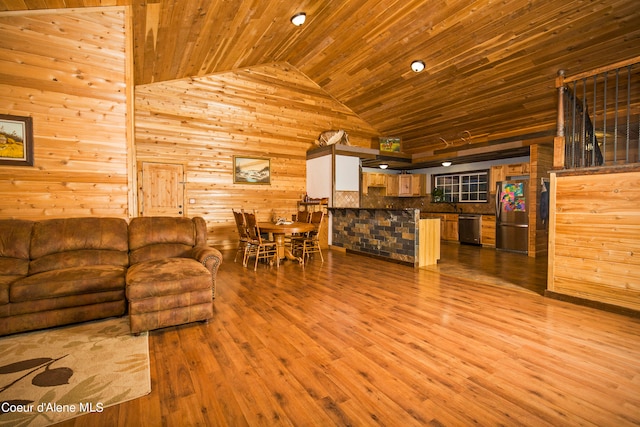 living room featuring wooden ceiling, wood walls, hardwood / wood-style floors, and high vaulted ceiling