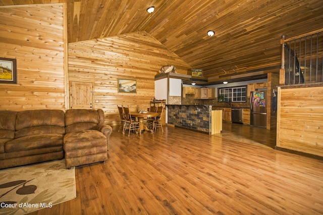 living room with wooden walls, high vaulted ceiling, wooden ceiling, and wood finished floors