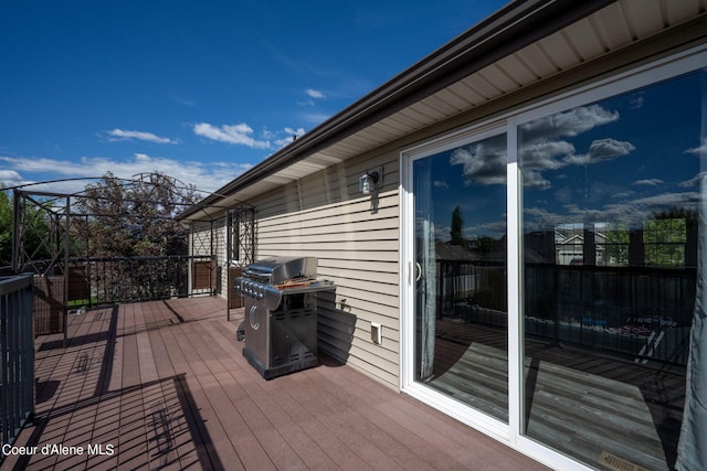 wooden terrace with area for grilling