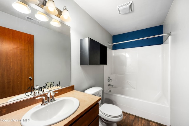 full bathroom featuring visible vents, wood finished floors, toilet, and vanity