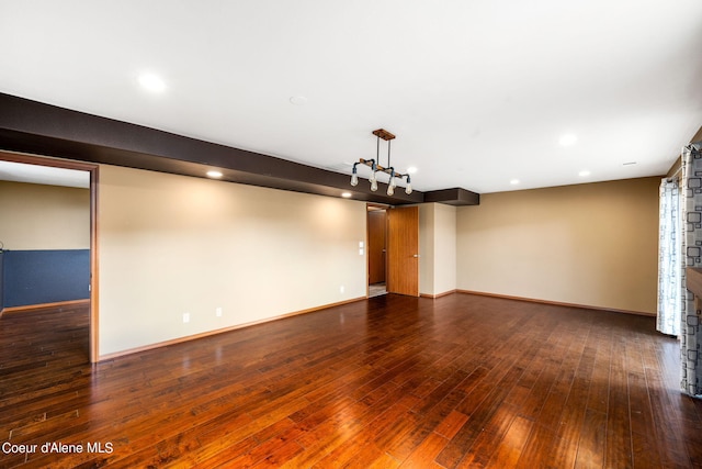 empty room with baseboards, recessed lighting, and hardwood / wood-style flooring