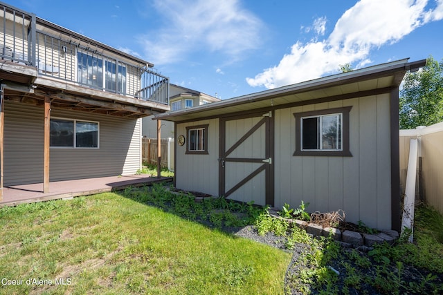 view of outbuilding with a yard