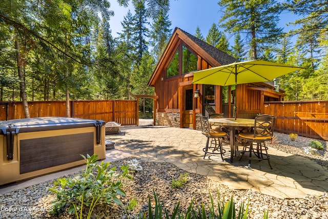 view of patio with a hot tub