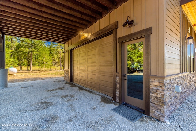 garage featuring wooden walls