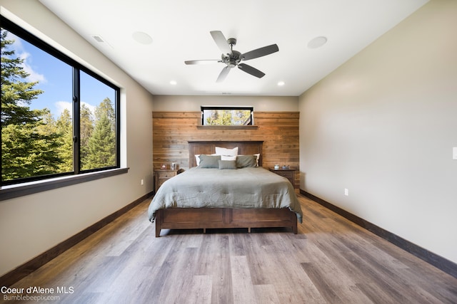 bedroom with hardwood / wood-style flooring and ceiling fan