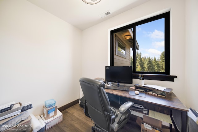 office space with dark wood-type flooring