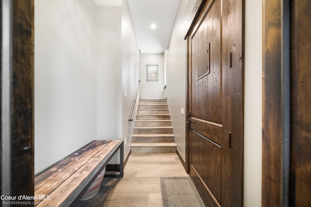 hallway with light hardwood / wood-style flooring