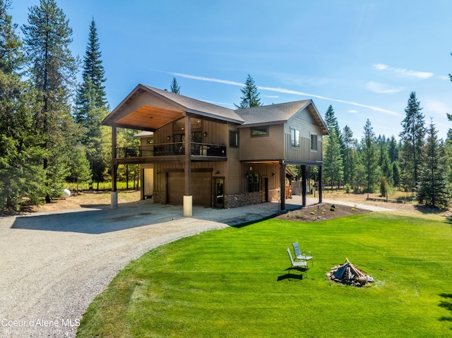 back of property with a lawn and a carport