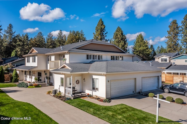 view of front property with covered porch, central air condition unit, and a front lawn