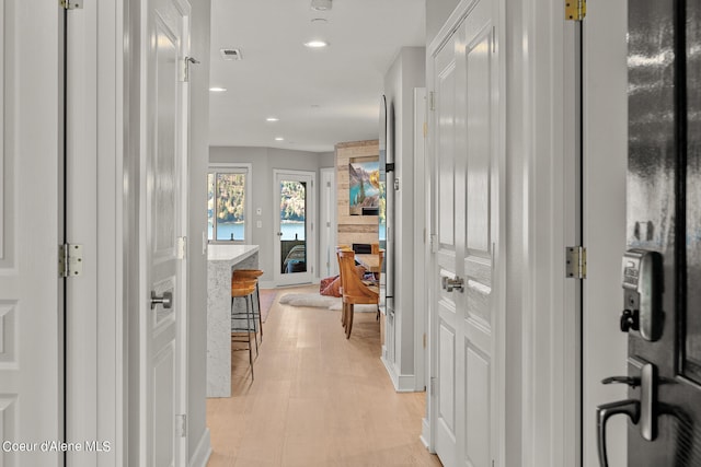 corridor featuring light hardwood / wood-style floors