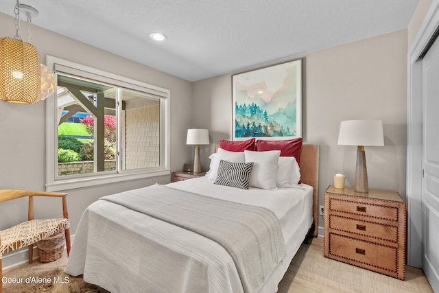 bedroom featuring a closet and a textured ceiling