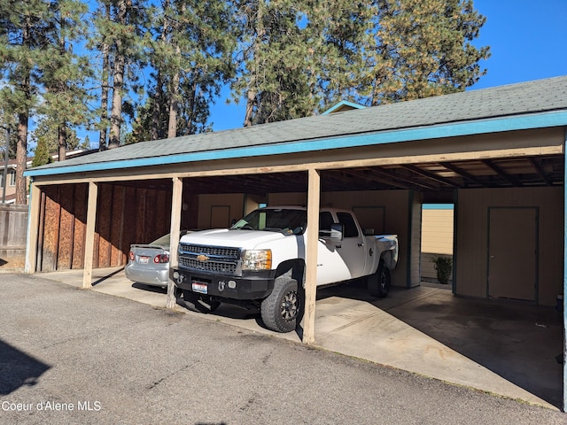 view of parking / parking lot with a carport