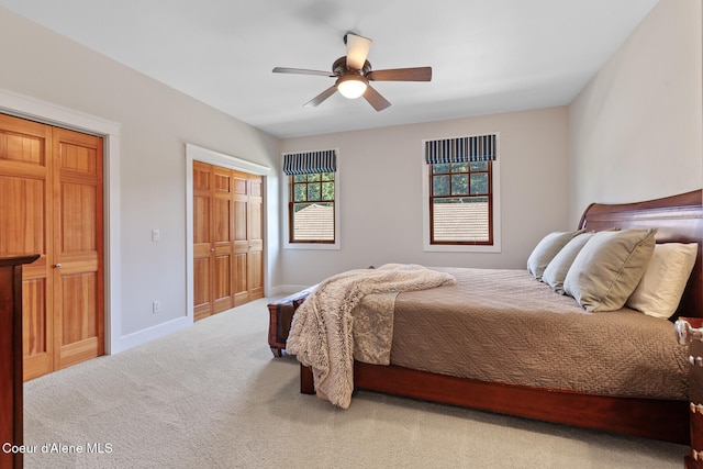 carpeted bedroom with ceiling fan