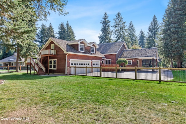 view of front facade with a garage and a front lawn