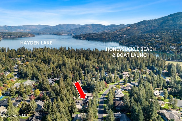 aerial view featuring a water and mountain view