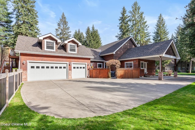 view of front facade with concrete driveway, roof with shingles, fence, and a garage