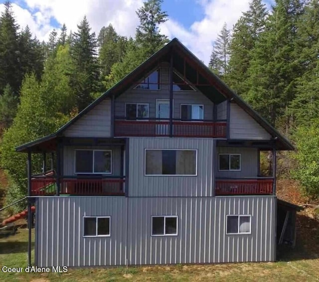 view of side of home with a balcony