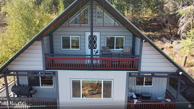 view of property exterior featuring outdoor lounge area and a balcony