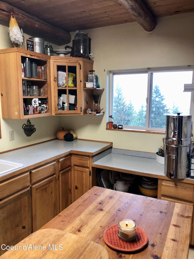 1452 Grizzly Gap Rd, Naples, ID 83847 - kitchen with open shelves, wooden ceiling, beamed ceiling, wood counters, and brown cabinetry