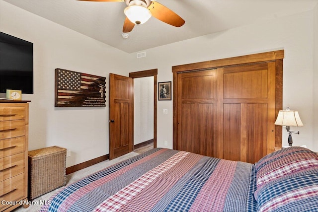 bedroom featuring ceiling fan and a closet