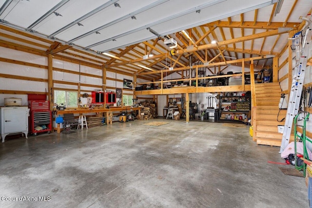 garage with a workshop area and a garage door opener