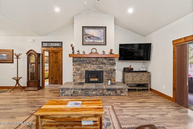 living room with lofted ceiling and light wood-type flooring