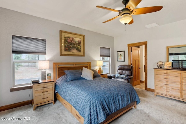 bedroom featuring ceiling fan and light carpet