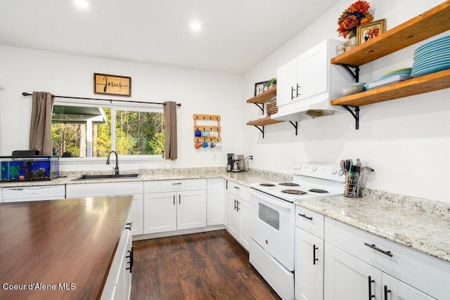 kitchen with dark hardwood / wood-style flooring, white cabinets, sink, and white appliances