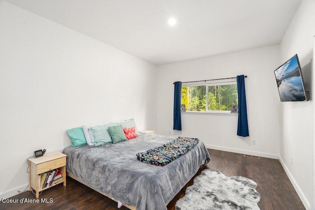 bedroom featuring dark wood-type flooring