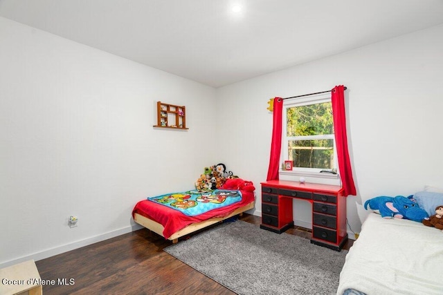 bedroom featuring dark wood-type flooring