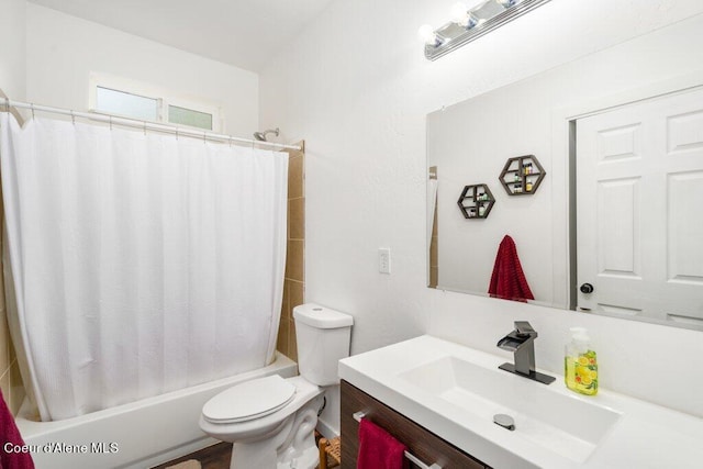 full bathroom with vanity, hardwood / wood-style floors, shower / bath combo, and toilet