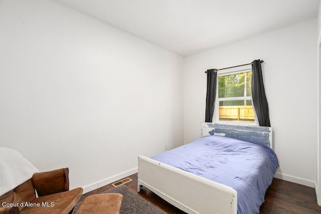 bedroom featuring dark hardwood / wood-style floors