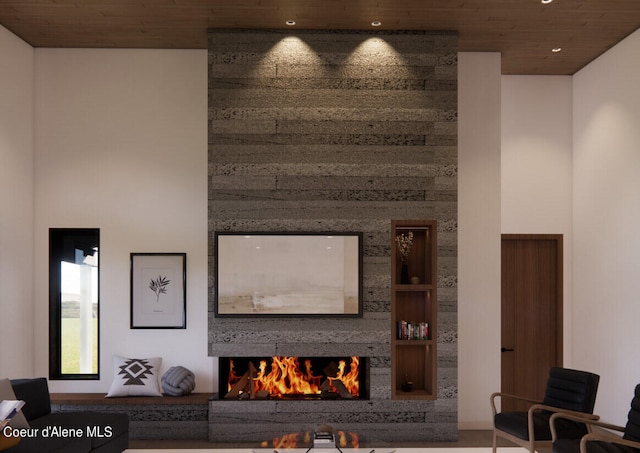 15374 S Chalone Dr, Coeur Dalene, ID 83814 - living area with wood ceiling, a high ceiling, and a large fireplace