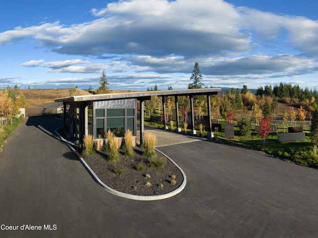 15374 S Chalone Dr, Coeur Dalene, ID 83814 - exterior space with a carport, driveway, and an outbuilding