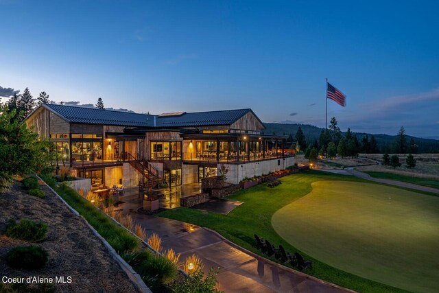 15374 S Chalone Dr, Coeur Dalene, ID 83814 - back of house at dusk featuring metal roof
