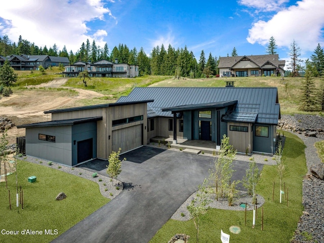 15374 S Chalone Dr, Coeur Dalene, ID 83814 - modern home with a standing seam roof, a metal roof, driveway, and a garage