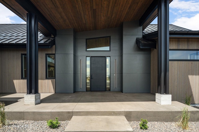 15374 S Chalone Dr, Coeur Dalene, ID 83814 - view of exterior entry with a metal roof, a patio, and a standing seam roof